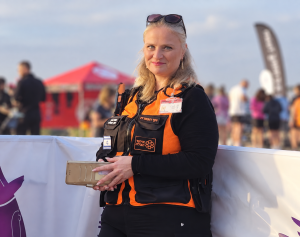 Smiling Rescue Volunteer at Outdoor Event