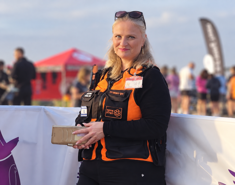 Smiling Rescue Volunteer at Outdoor Event