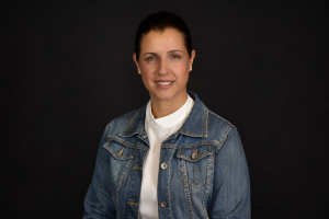 Woman in Denim Against Black Background